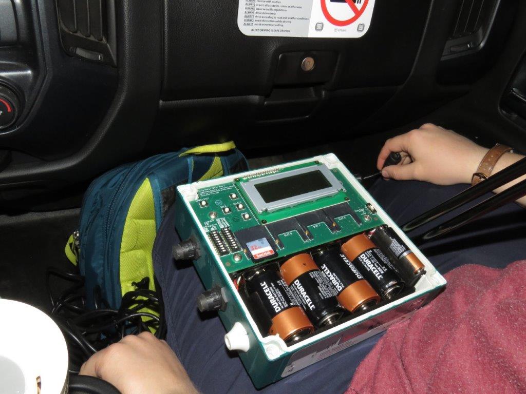 Monitoring device on the lap of a person in the batmobile