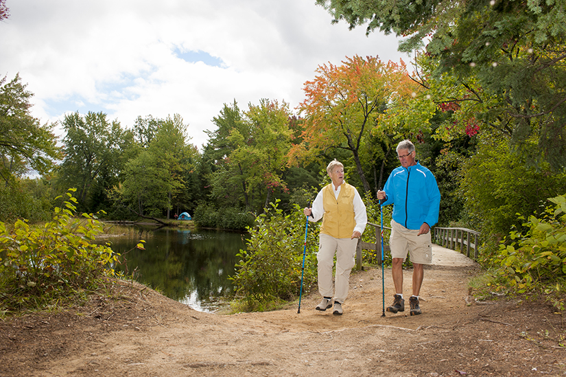 Senior couple hiking on trail