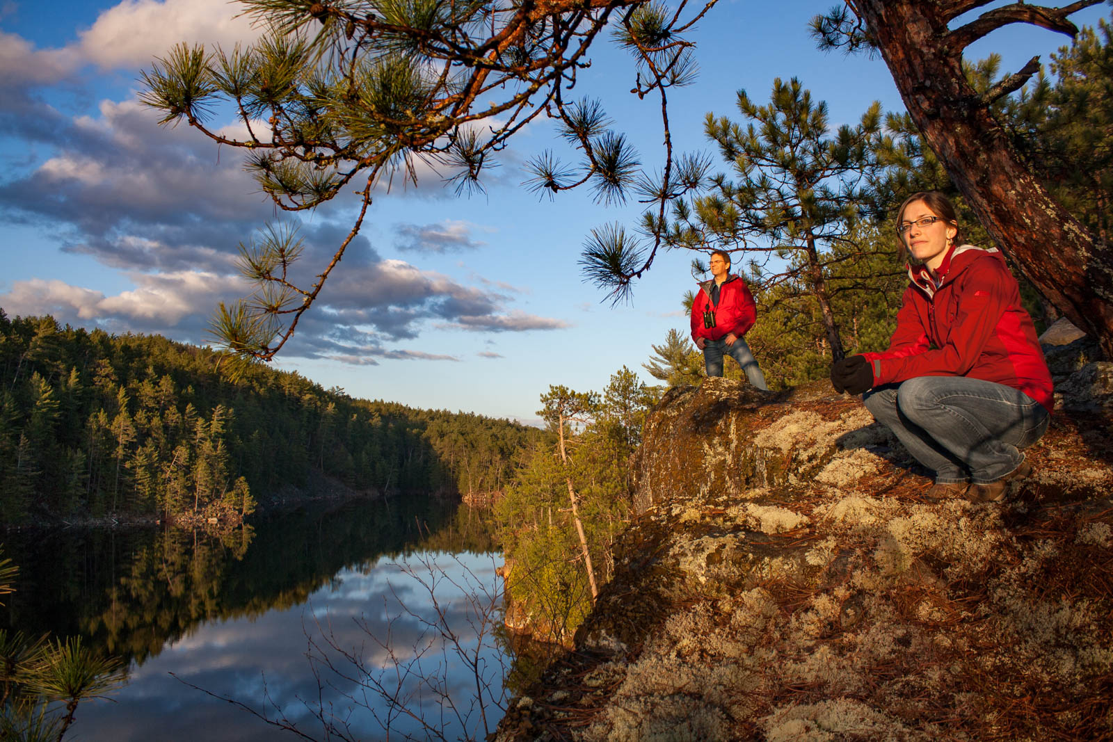 hikers on overlook over lake