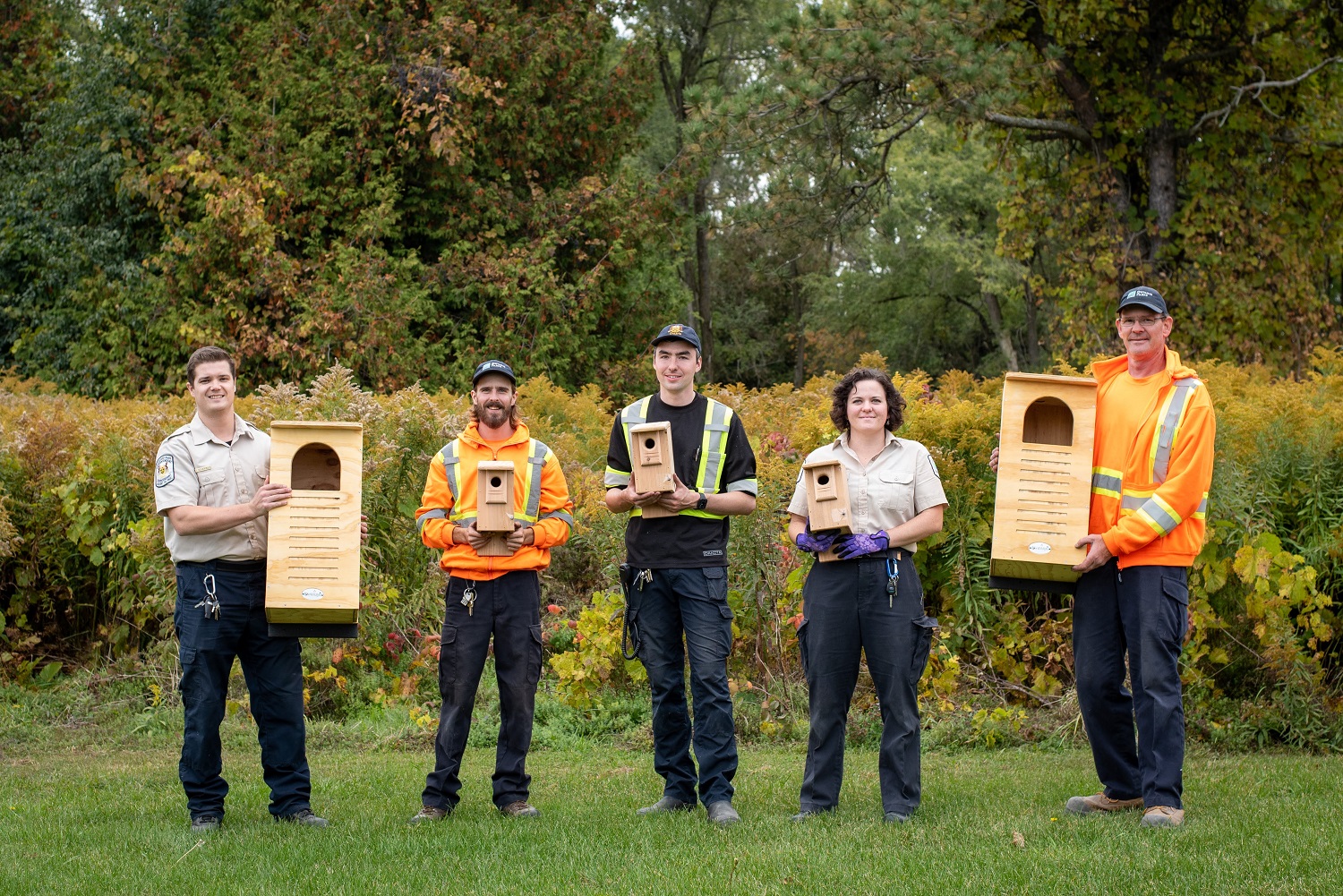 Rondeau staff holding new bird and bat boxes