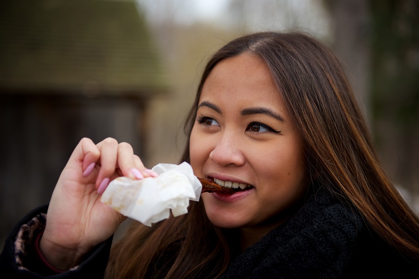 Woman eating taffy