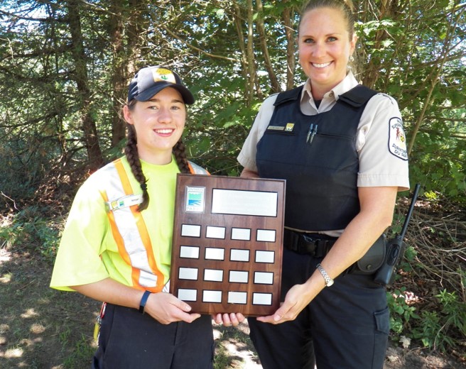 staff member holding plaque next to Superintendent 