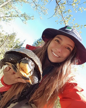 staff member holding turtle