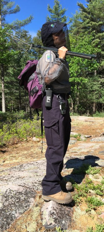 snake researcher in full gear