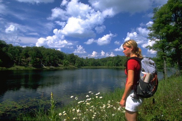 person standing on trail