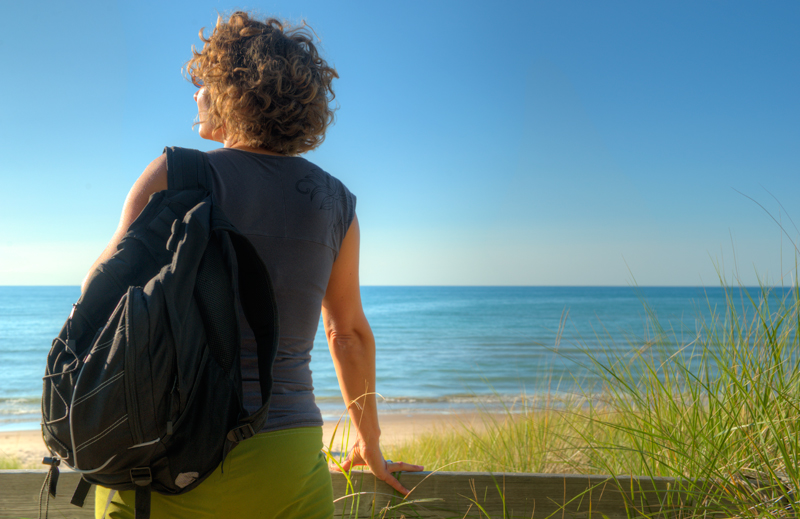 woman looking out over beach