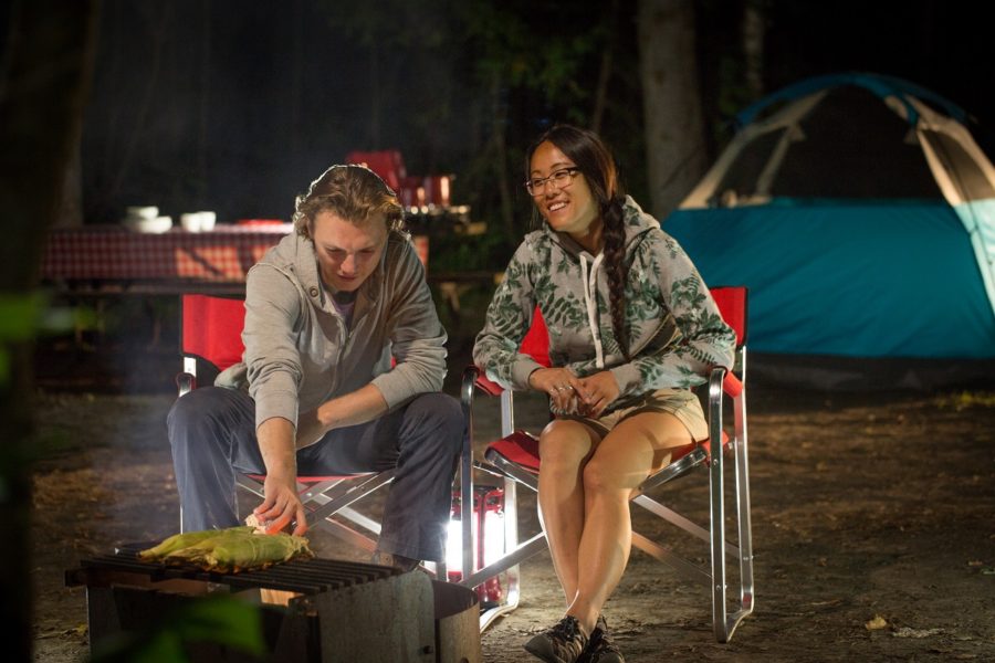 couple in front of campfire