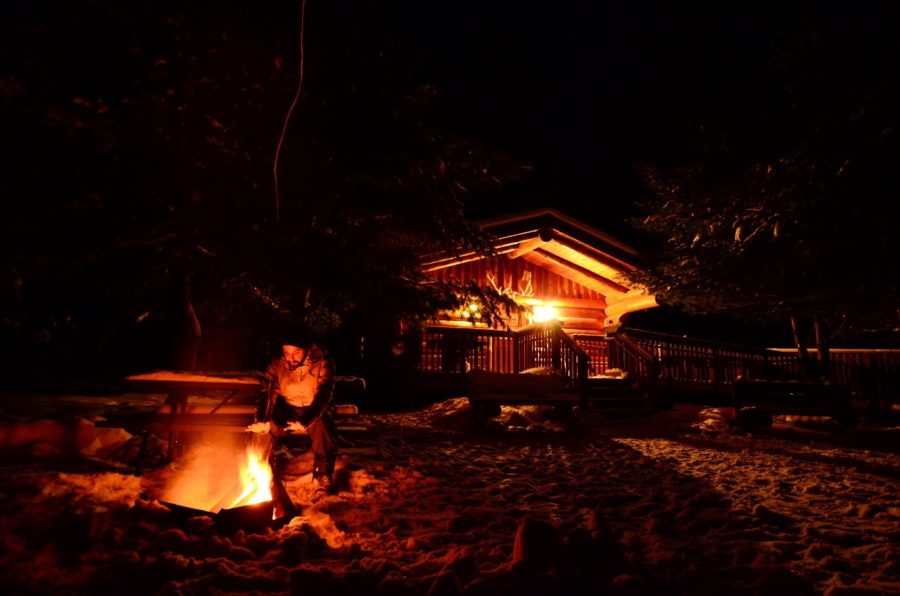 Quetico cabin at night with campfire