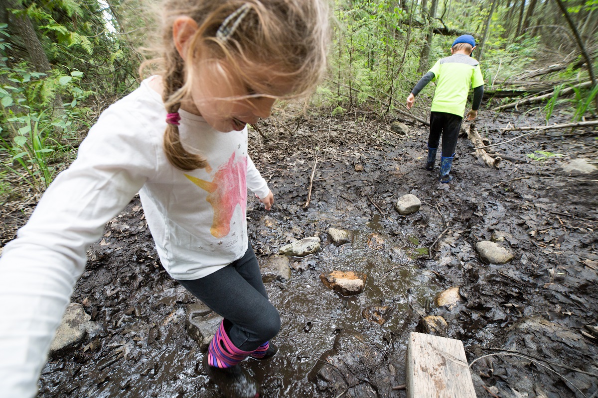 children playing in mud