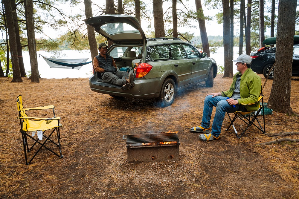 group sitting around fire