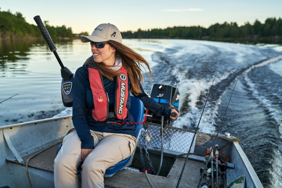 Ashley driving the motorboat she rented from across the bay.