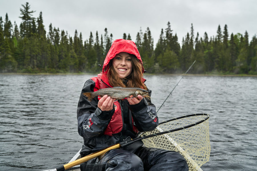 Ashley holding one of the fish she caught while in the rain.