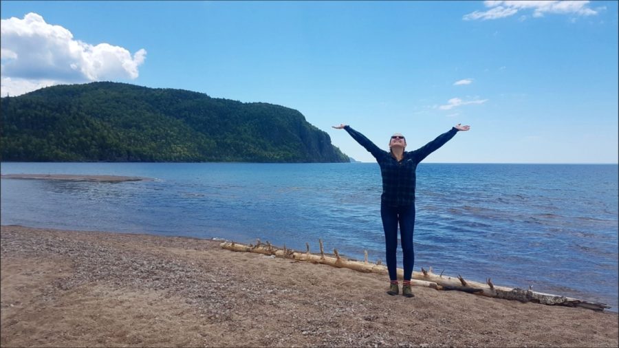 Kelly standing on the shores of Old Woman Bay.