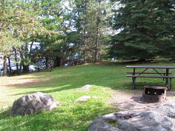 View of site 17. You can see the shimmer water just pas the line of trees by the water.