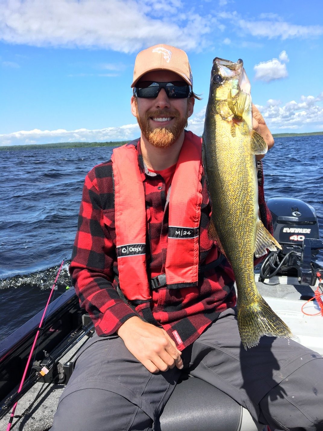 Mitch with an 18” White Lake Walleye in his hands.