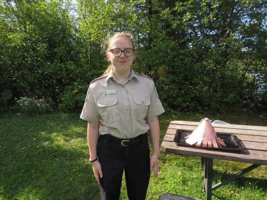 staff standing beside picnic table