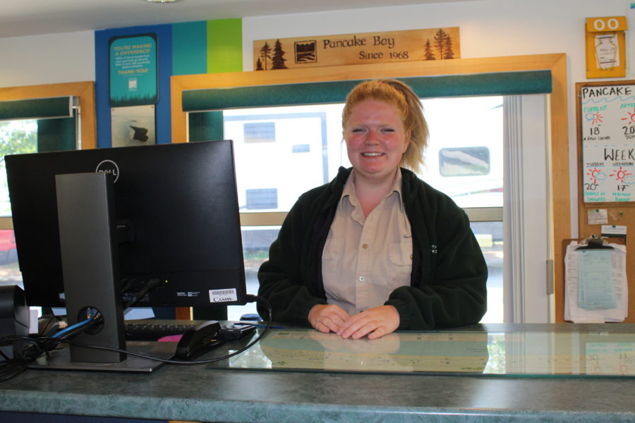 Kathleen working as a gate attendant at Pancake Bay Provincial Park