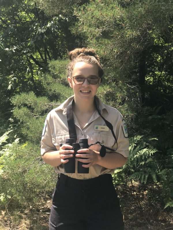 staff holding binoculars