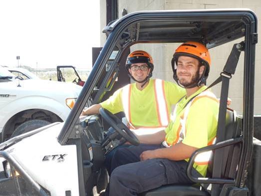 two staff in a cart