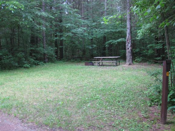 View of site 114 shows large site with full grass.