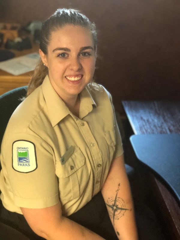 staff in uniform sitting in chair