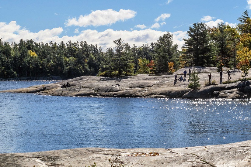 Hikers on a rocky point.