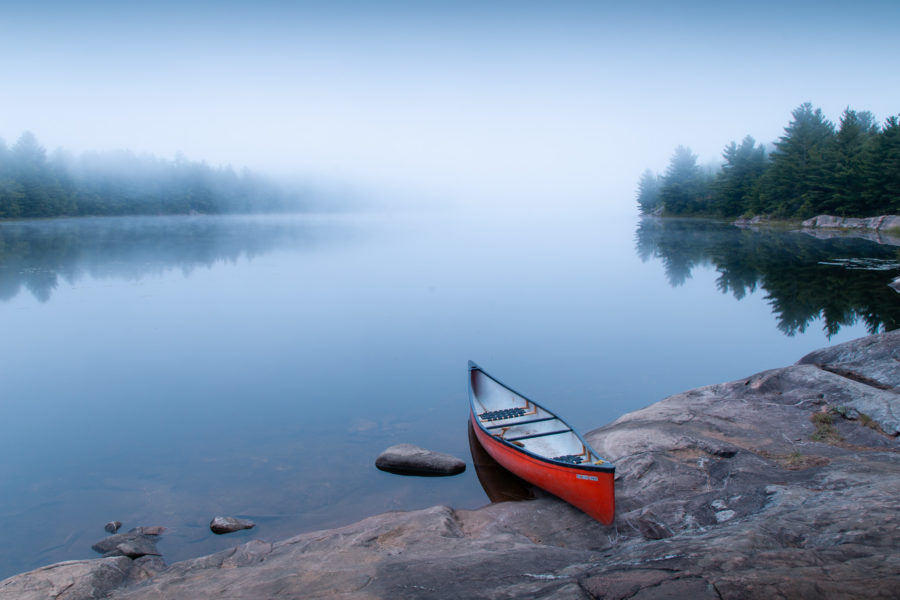 Morning photo of canoe on shore.