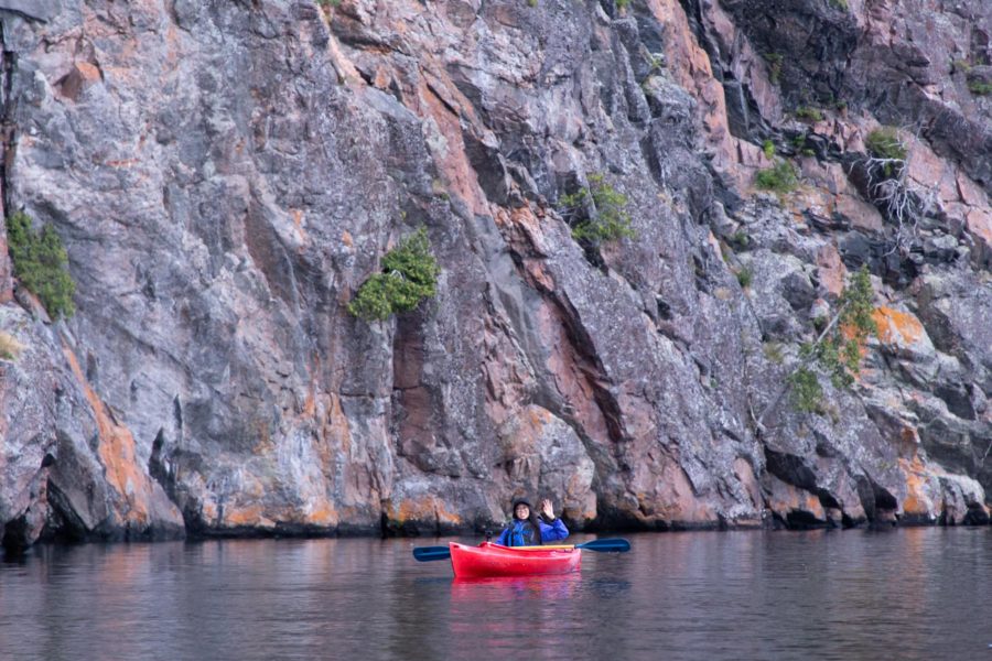 Paddling in front of Mazinaw Rock.