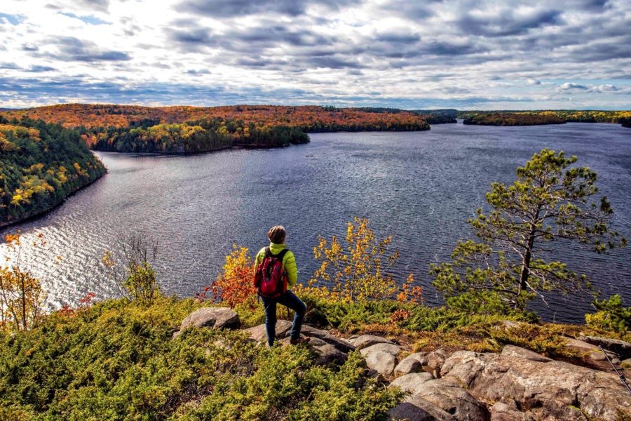 Hiker at the top of Stormy Lake Lookout.