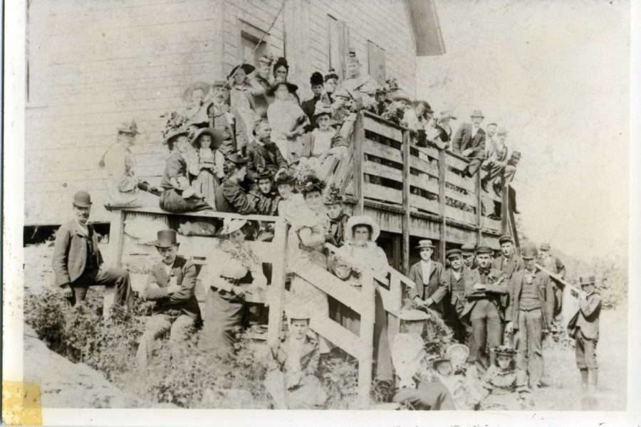 Photo of the community in front of a building.