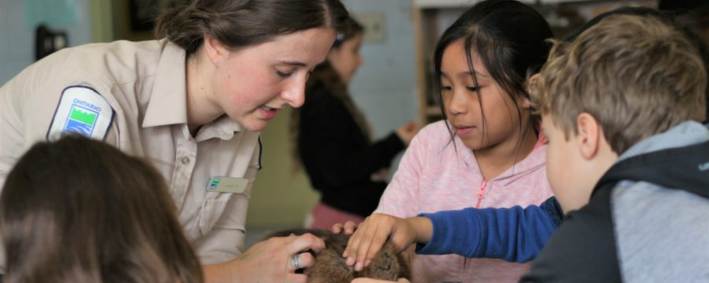 Jessica leading a school program
