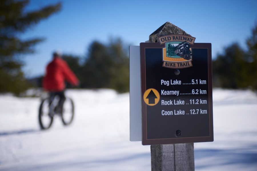 Fatniker in the distance behind a sign