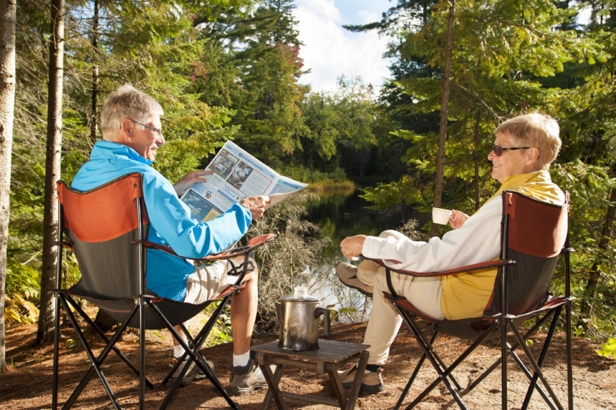 A couple reading newspapers