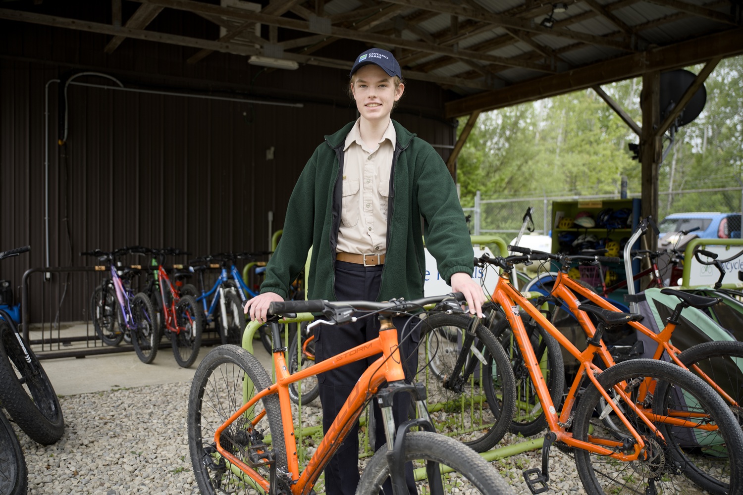 park staff at bike rental kiosk