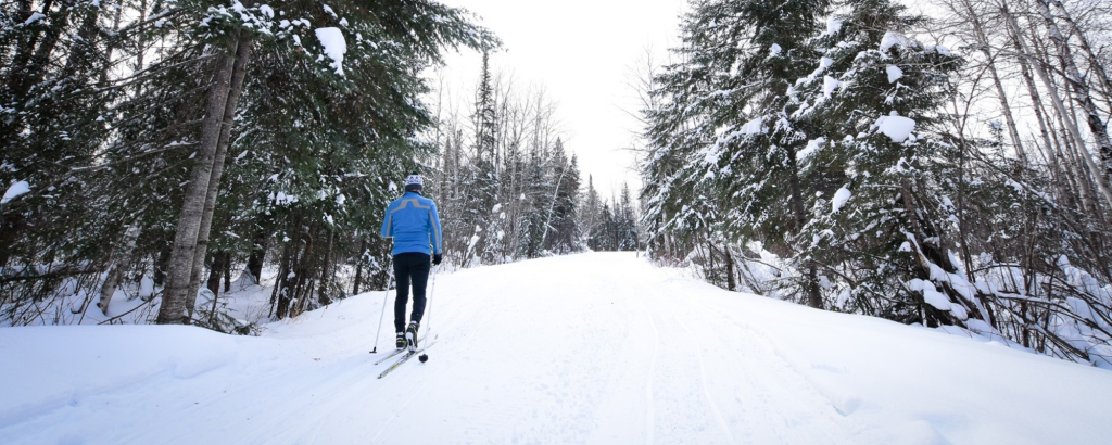 person skiing on trail