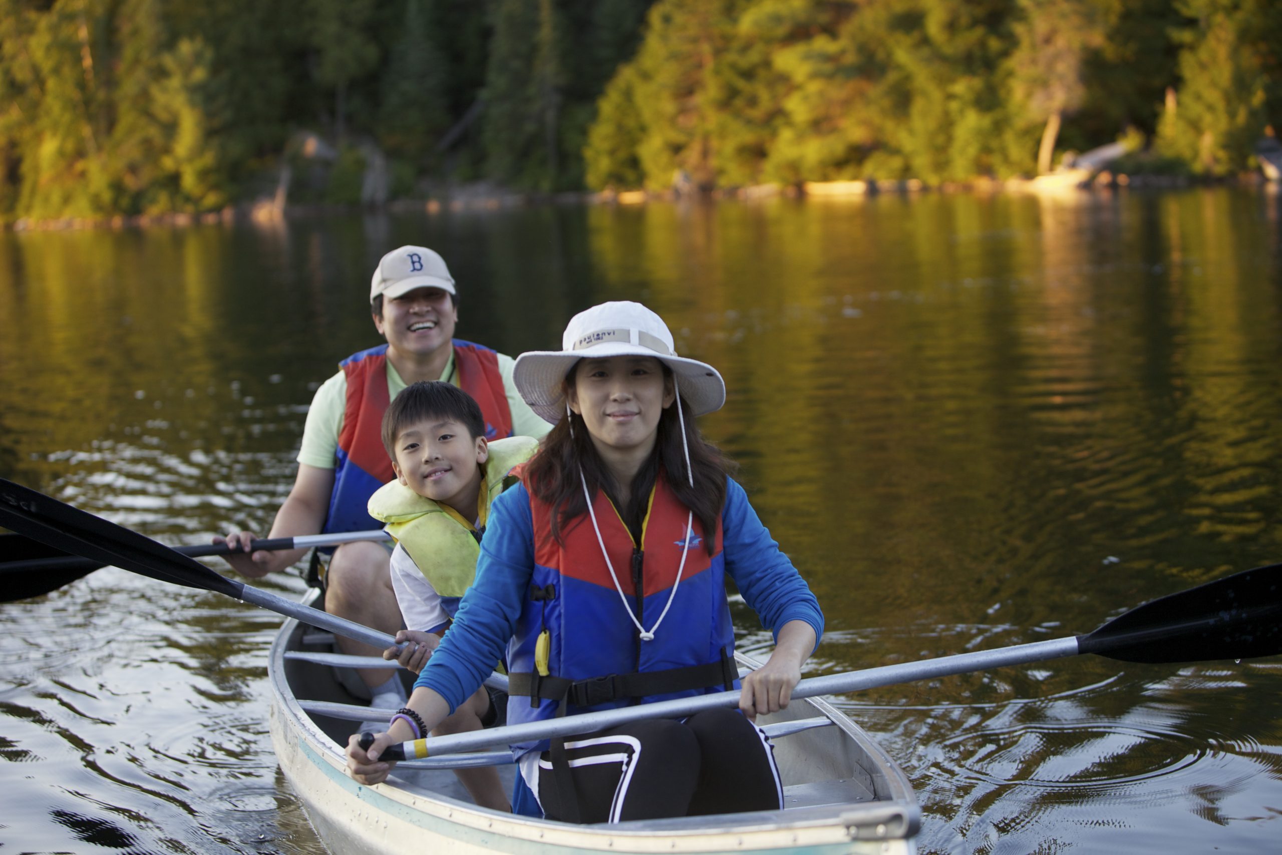 Family canoeing on a lake