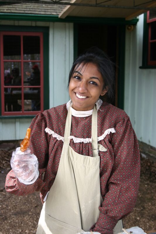 Student serving maple syrup toffee.