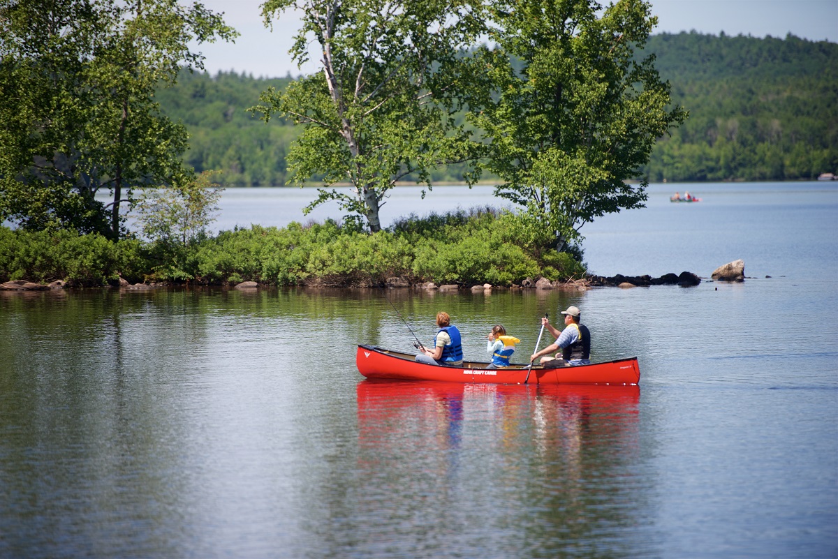 Family paddling canoe at Driftwood PP,