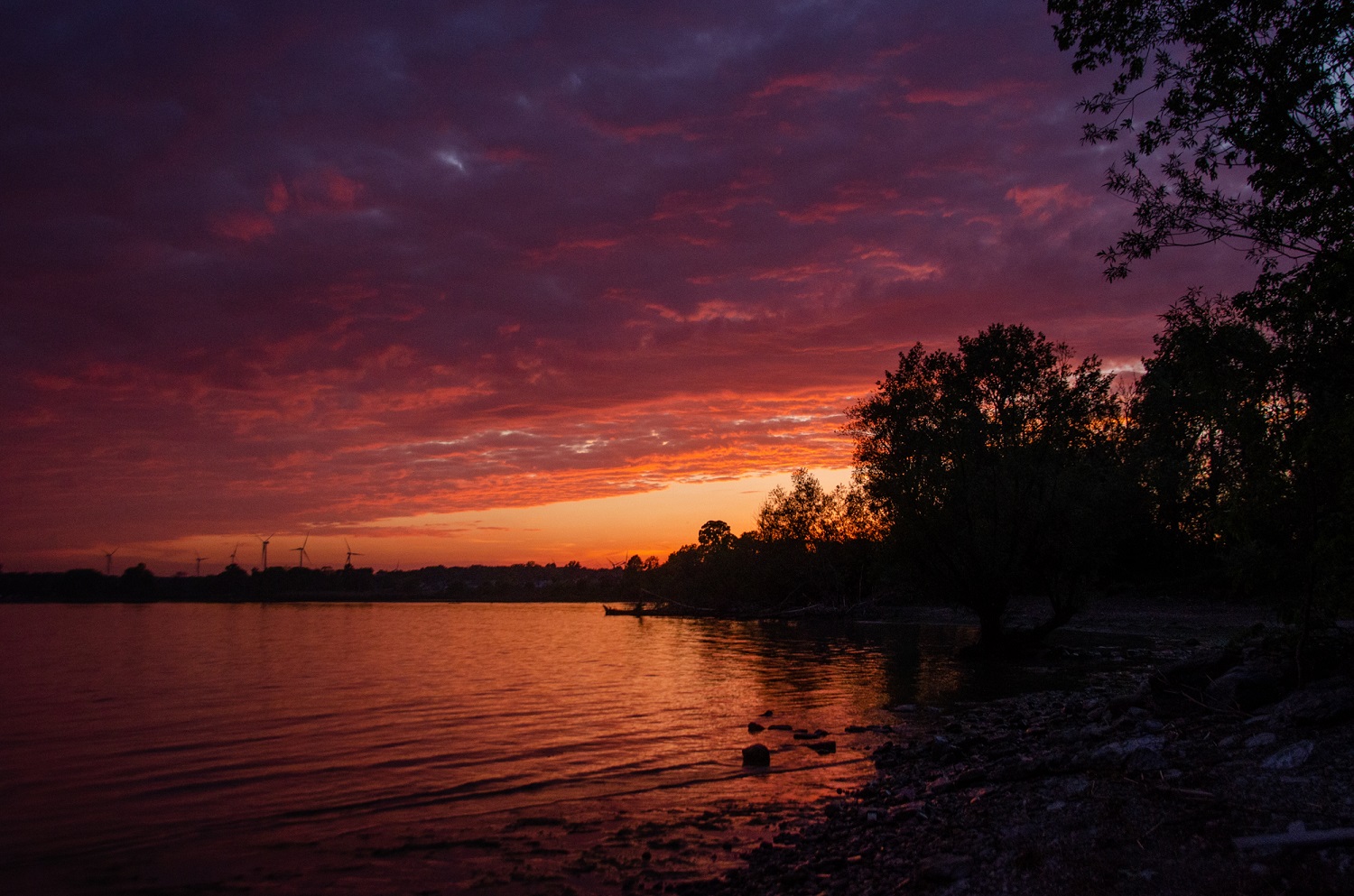 Purple and orange sunset over lake at Selkirk Provincial Park