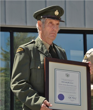 man holding award