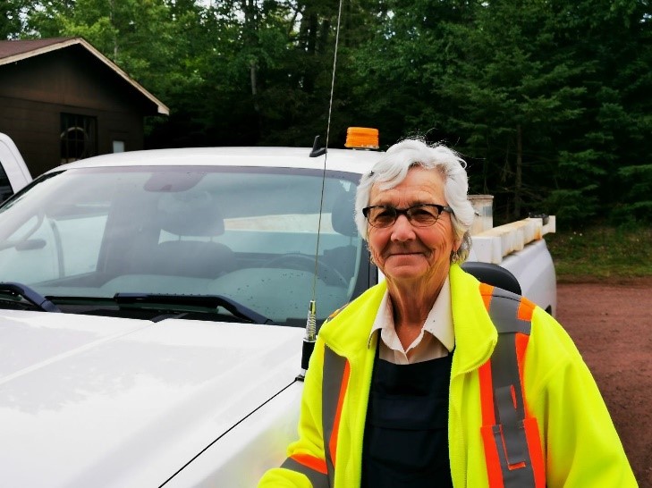 staff standing by car