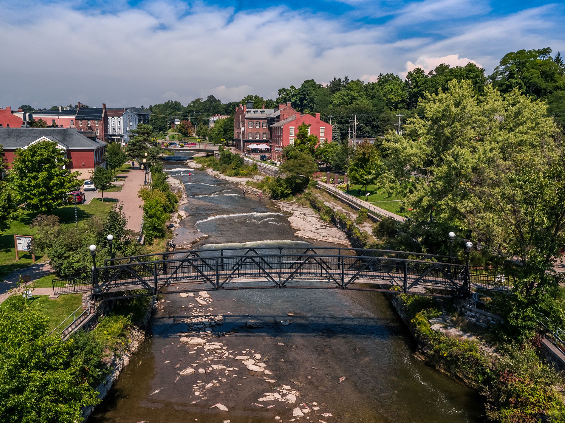 bridge over a river with Port Hope downtown in the background