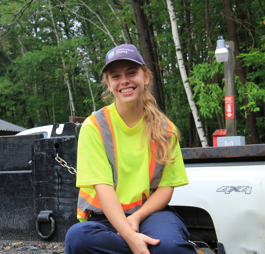 staff sitting in front of truck