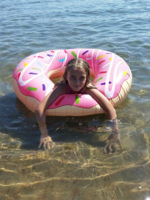 child swimming with inflatable tube