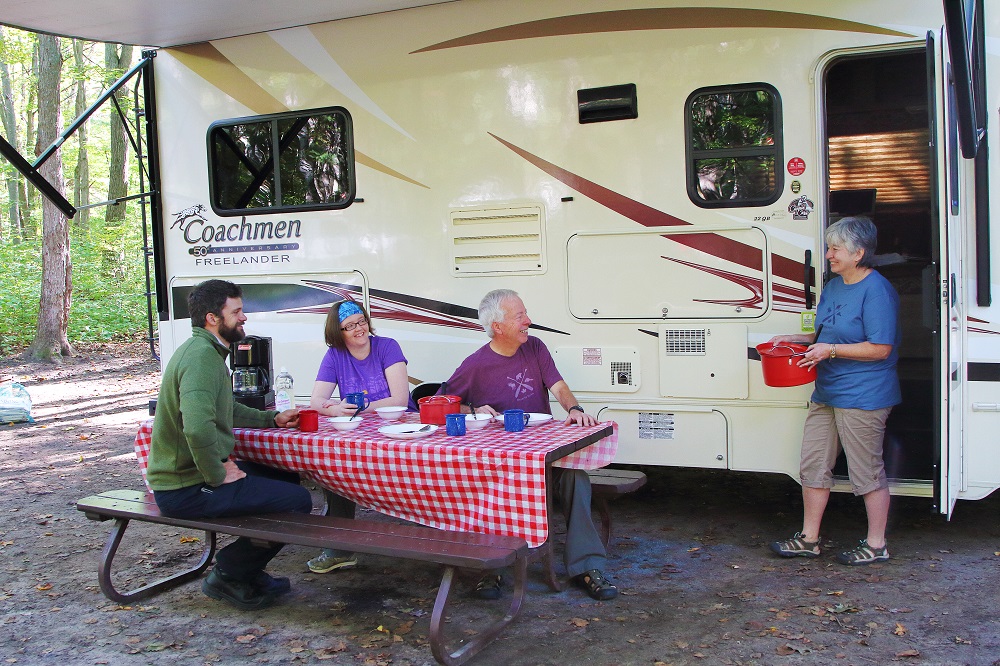 family in front of RV