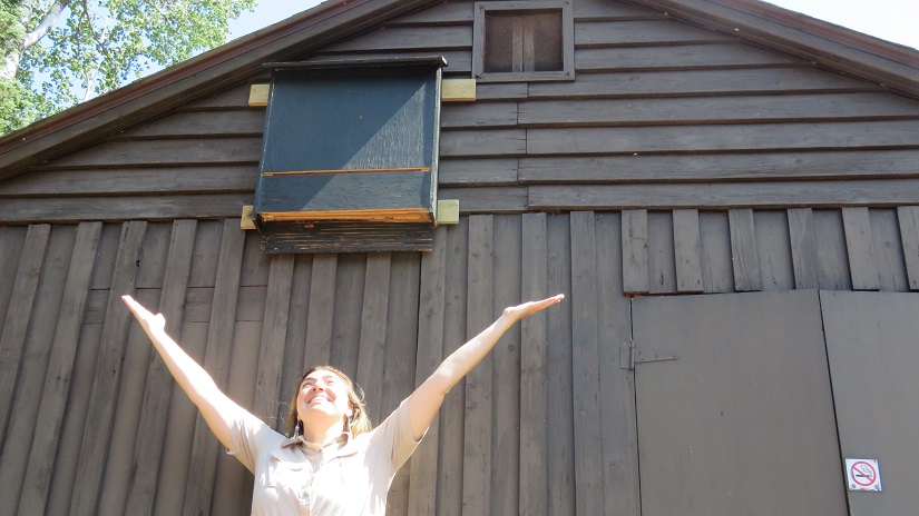 Park staff in front of bat house