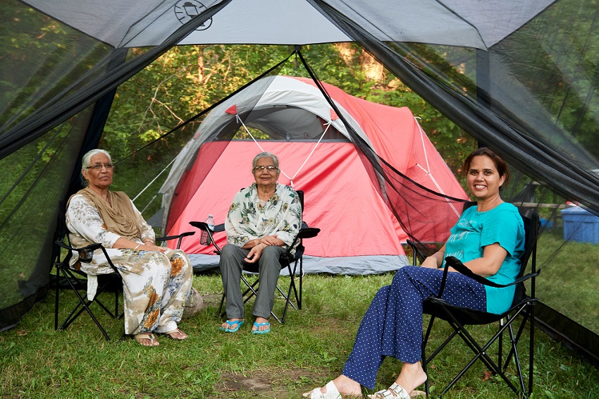 group sitting under dining shelter