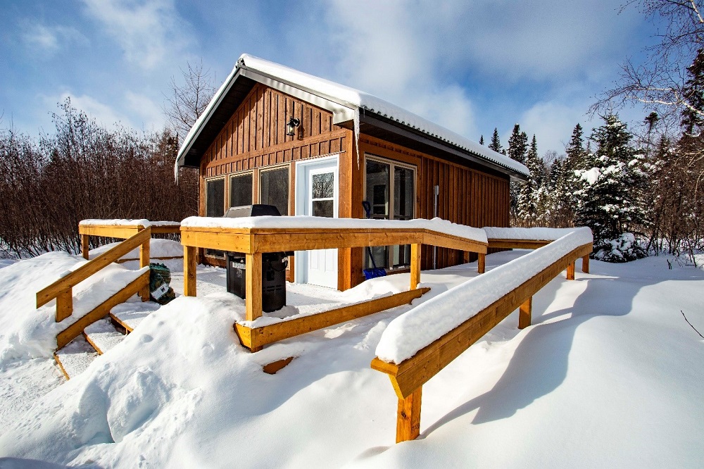 cabin covered in snow