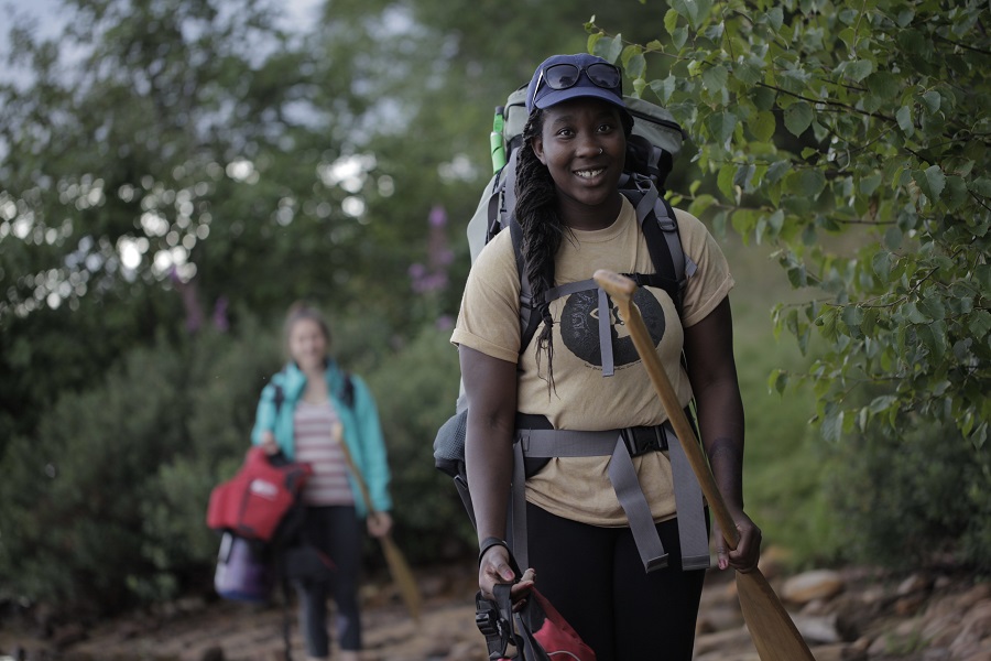 Women carrying their backcountry gear.