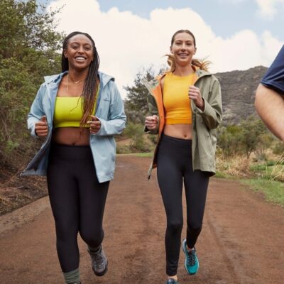 Two women jogging on trail.